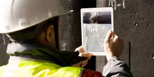 construction employee on tablet in the field